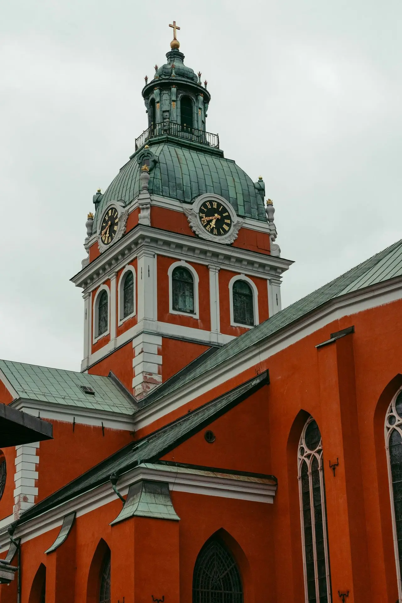 a large red building with a clock tower